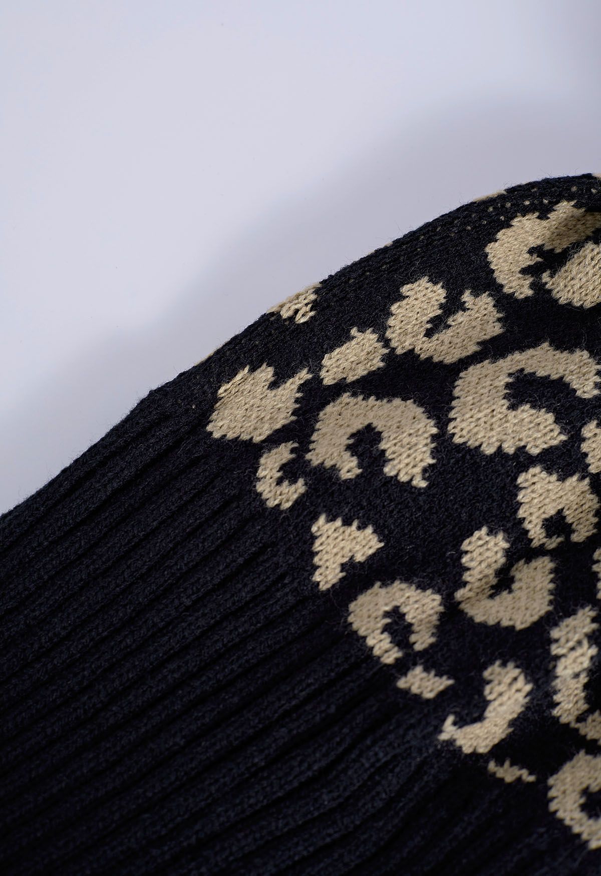 Fuzzy Pom-Pom Leopard Knit Beanie Hat in Black