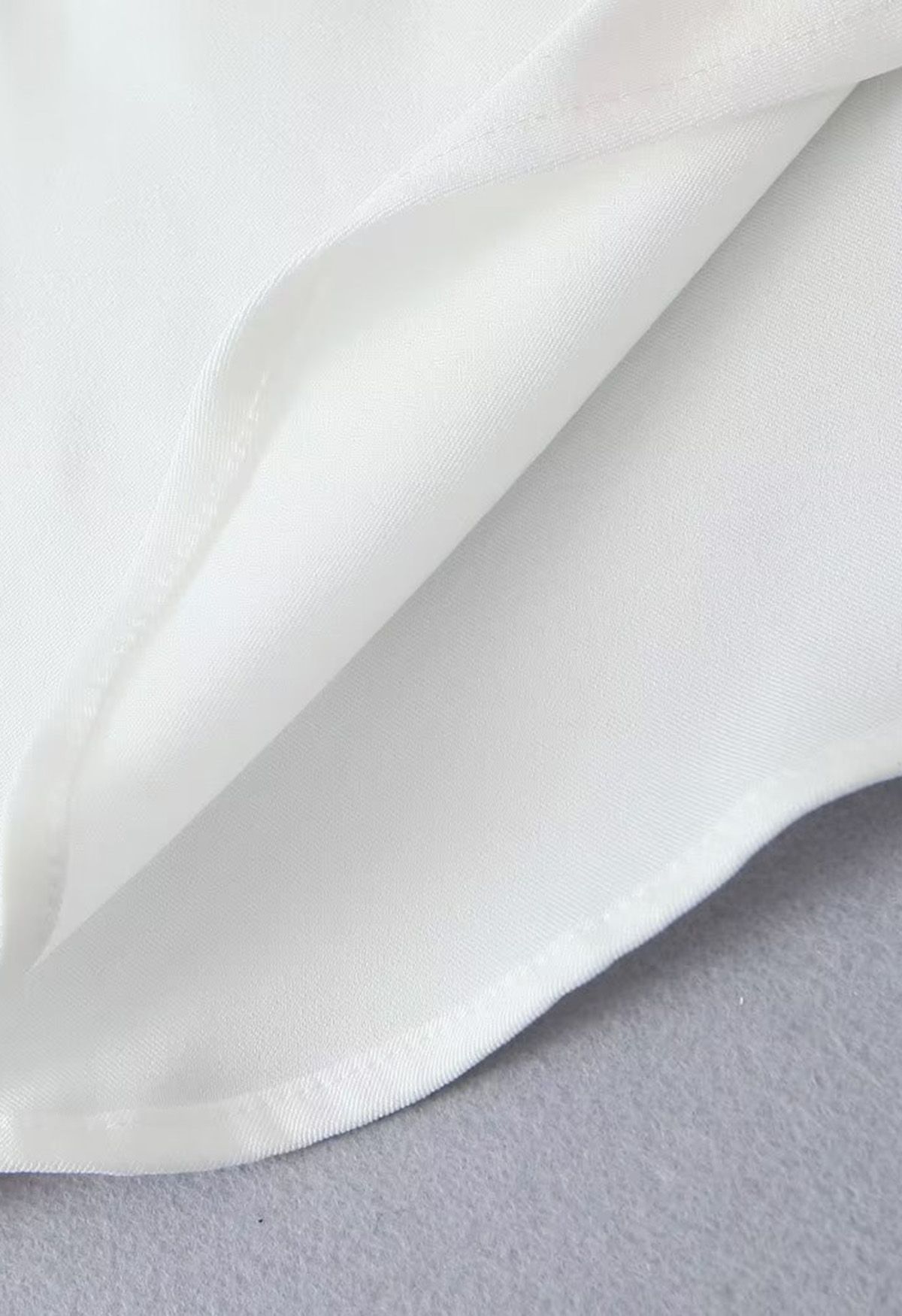 One-Shoulder Asymmetric Hem Top in White